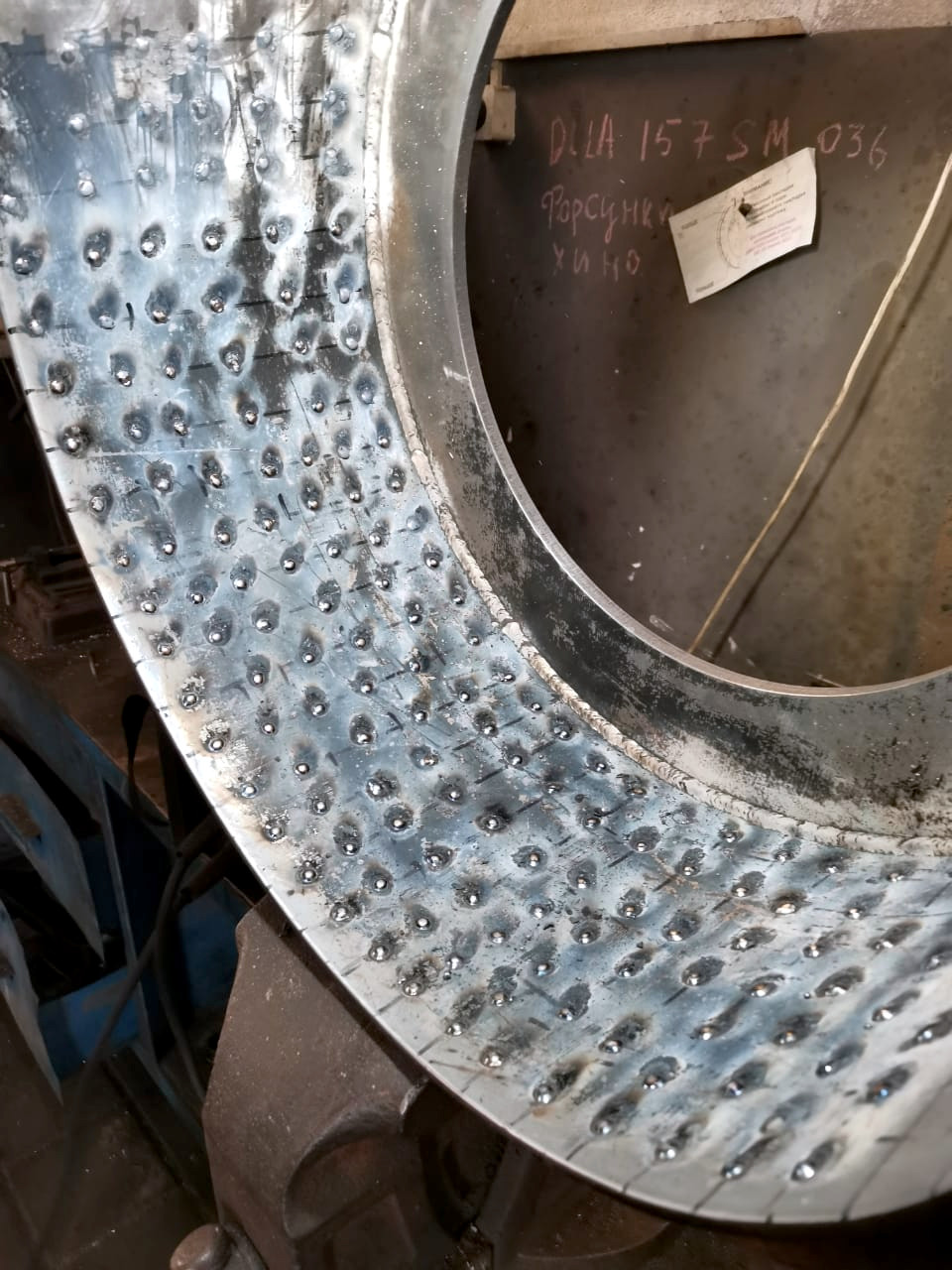 diffuser die surface coated with weld drops